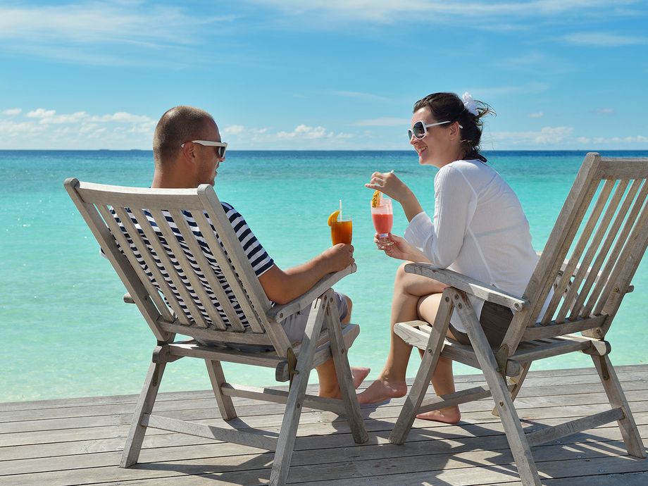 Couple enjoying cruise holiday drinks
