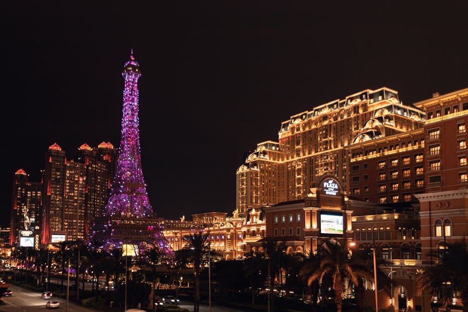 Vibrant night view of the Parisian Macao featuring its iconic illuminated Eiffel Tower replica.