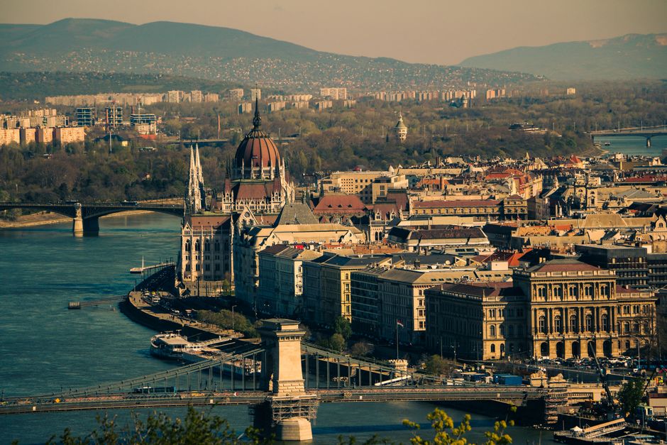 A breathtaking aerial shot capturing Budapest's iconic skyline with the Danube River, featuring historic architecture.