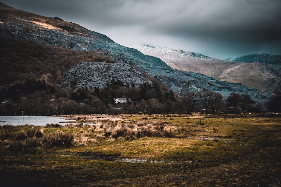 Breathtaking view of a mountainous landscape with moody skies and natural scenery.
