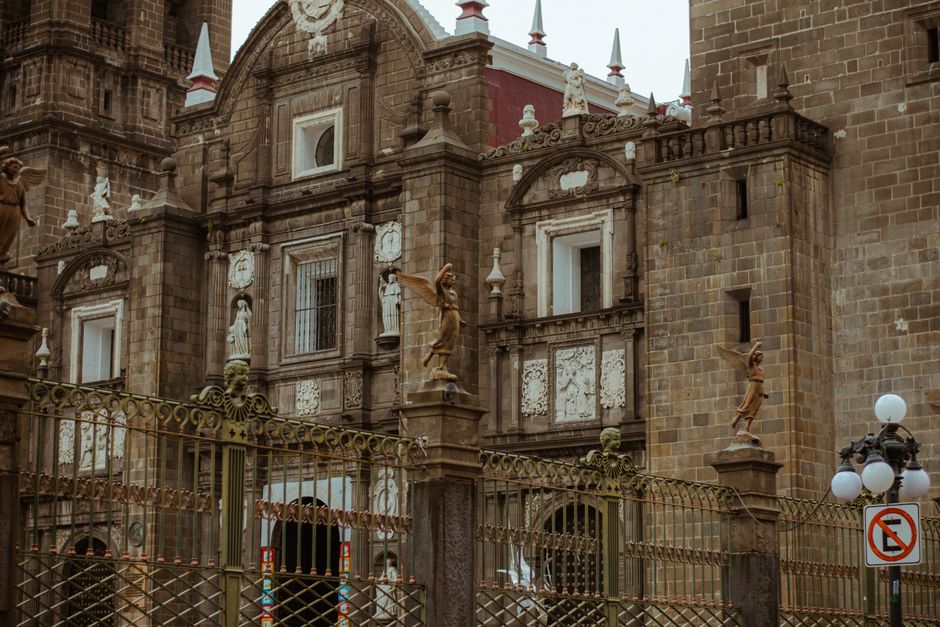 A historic cathedral facade featuring intricate architectural details and statues, showcasing classic design.