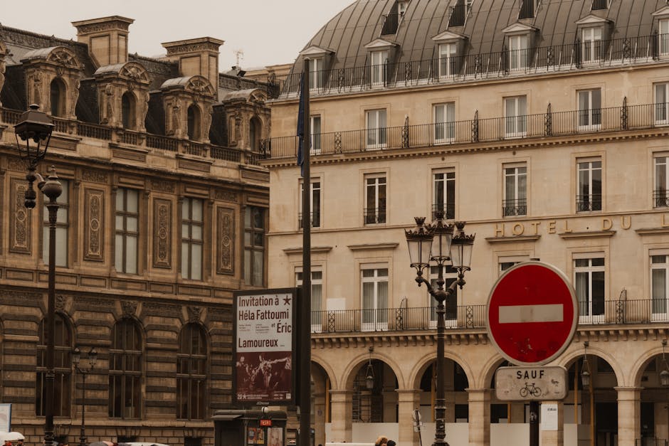 Capture of classic Parisian architecture with a moody sky and street details.